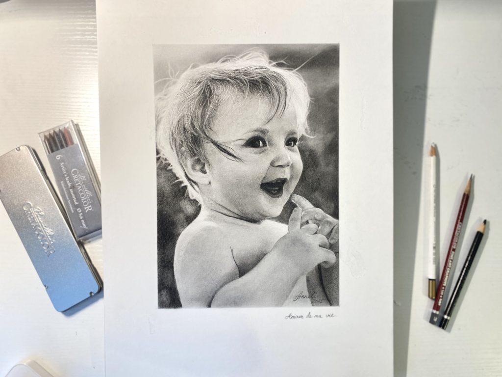 Realistic pencil portrait of a smiling child